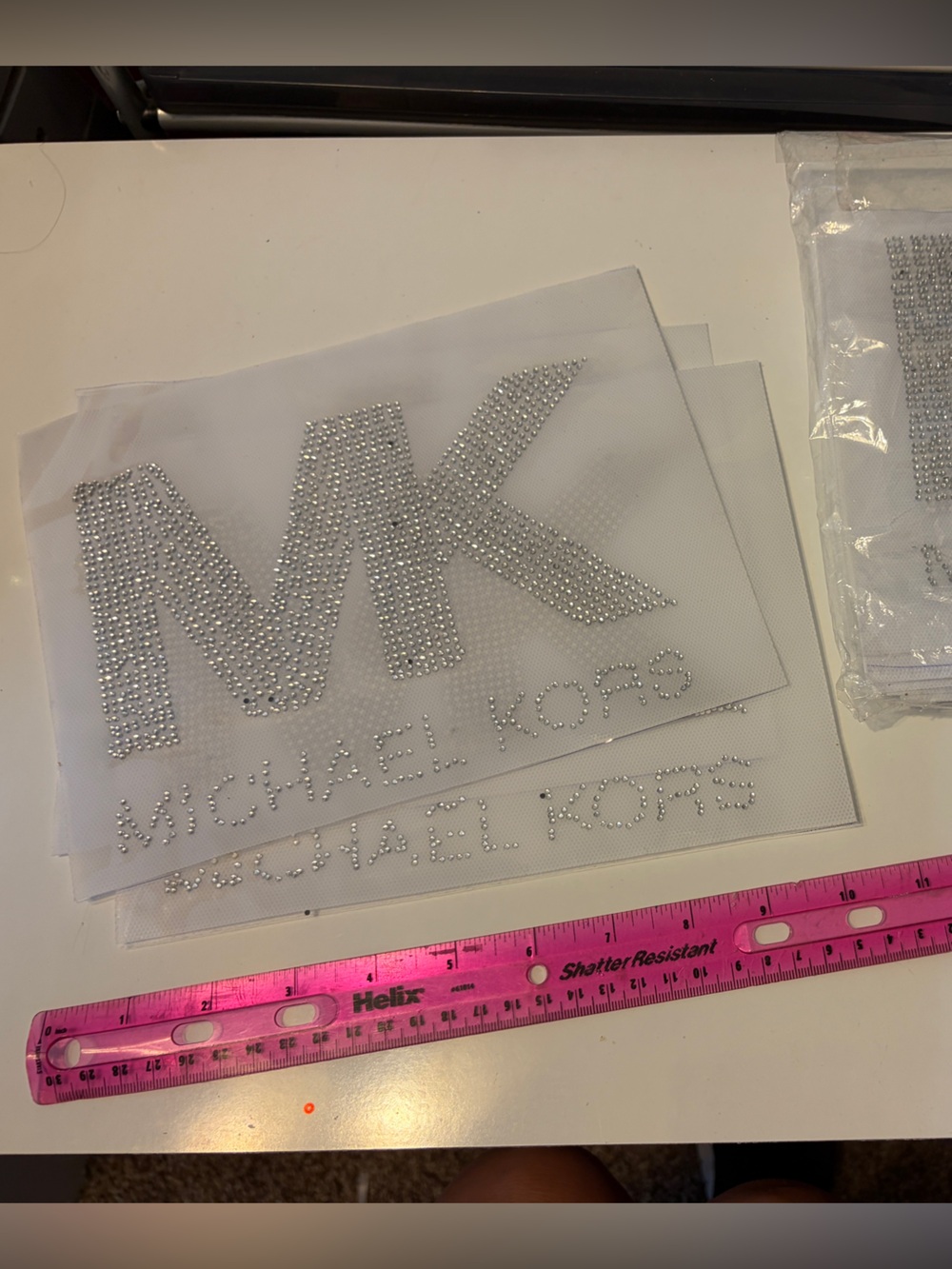 Michael Kors silver rhinestone transfers. 9” x 6”. Set of 12.  New in package.